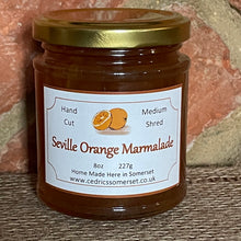 Load image into Gallery viewer, Our ‘Taste of the West’ 2022 Gold Award Winning Marmalade.  A classic Marmalade made with Organic Seville Oranges!   Serving Suggestion: Scrumptious on thick, hot buttered toast and toasted teacakes.  Made by Hand at Cedrics in Somerset, England in tiny batches.