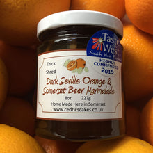 Load image into Gallery viewer, Dark Seville Orange and Somerset Beer Marmalade. Our ‘Taste of the West’ 2015 Award Winning Marmalade.  Organic Seville Oranges and Somerset Beer combines to create a dark and delicious marmalade.  Serving Suggestion: Salutes Breakfast in style - Delicious on hot buttered toast  Made by Hand at Cedrics in Somerset, England in tiny batches.