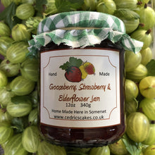 Load image into Gallery viewer, Gooseberry, Strawberry and Elderflower Jam. A marriage of decedent hedgerow flowers and summer fruit, combine to make an extraordinarily tasty and fragrant jam. Delicious!  Serving Suggestion: Try me thickly spread on freshly baked Scones!  Made by Hand at Cedrics in Somerset, England in tiny batches.
