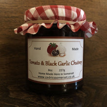 Load image into Gallery viewer, Our ‘Taste of the West’ 2021 Gold Award Winning Chutney. A wonderful Chutney made with Tomatoes and black garlic Serving Suggestion: Try in a Ham sandwich, as a dip, and of course along side your favourite cheese. Made by Hand at Cedrics in Somerset, England in tiny batches.