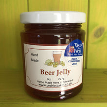 Load image into Gallery viewer, Cedrics Beer Jelly. Our ‘Taste of the West’ 2017 Award Winning Beer Jelly.  A bright, hoppy jelly ideal in numerous delicious situations!  Serving Suggestion: Try as an alternative to honey on hot buttery toast;  with a strong cheddar on a cheese board;  Glaze chicken and Pork chops for a summer BBQ!  Find your favourite combination and let us know!  Made by Hand at Cedrics in Somerset, England in tiny batches.