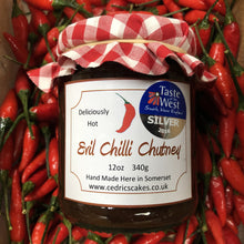 Load image into Gallery viewer, Evil Chilli Chutney. Our ‘Taste of the West’ 2016 Silver Award Winning Chutney. A great chutney with a kick. Serving Suggestion: Try pairing with a Traditional Somerset cheddar and enjoy the delicious heat. Made by Hand at Cedrics in Somerset, England in tiny batches.
