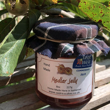 Load image into Gallery viewer, Medlar Jelly.  Our ‘Taste of the West’ 2019 Highly Commended Award Winning Jelly.  A lovely fruity Jelly made with Medlars and Apples  Serving Suggestion: Try me on Roast Pork, or with a Cheese board!    Made by Hand at Cedrics in Somerset, England in tiny batches. 
