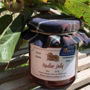 Medlar Jelly.  Our ‘Taste of the West’ 2019 Highly Commended Award Winning Jelly.  A lovely fruity Jelly made with Medlars and Apples  Serving Suggestion: Try me on Roast Pork, or with a Cheese board!    Made by Hand at Cedrics in Somerset, England in tiny batches. 