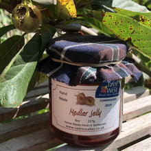 Load image into Gallery viewer, Medlar Jelly.  Our ‘Taste of the West’ 2019 Highly Commended Award Winning Jelly.  A lovely fruity Jelly made with Medlars and Apples  Serving Suggestion: Try me on Roast Pork, or with a Cheese board!    Made by Hand at Cedrics in Somerset, England in tiny batches. 
