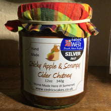 Load image into Gallery viewer, Sticky Apple and Scrumpy Cider Chutney. Our ‘Taste of the West’ 2017 Silver Award Winning Chutney.  A smooth, mellow full-bodied chutney.   Serving Suggestion: Perfect with Cold cuts and local cheeses. Try with a Ploughman&#39;s.  Made by Hand at Cedrics in Somerset, England in tiny batches. 
